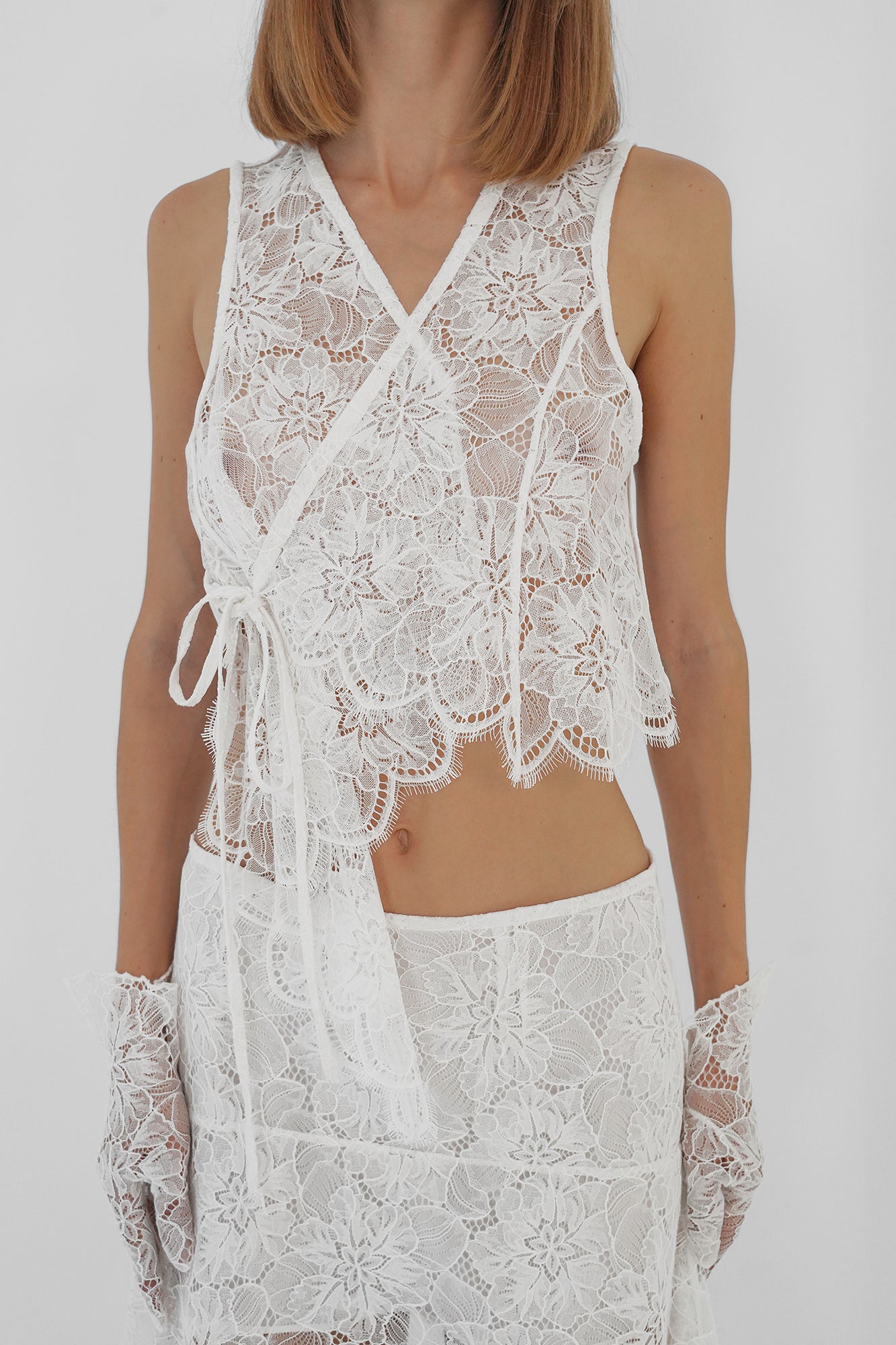 Asymmetric lace vest